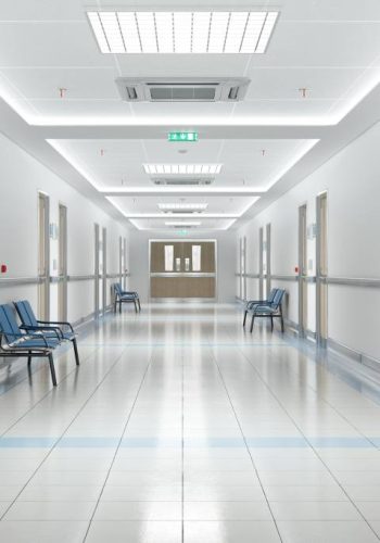 Long hospital bright corridor with rooms and blue seats 3D rendering